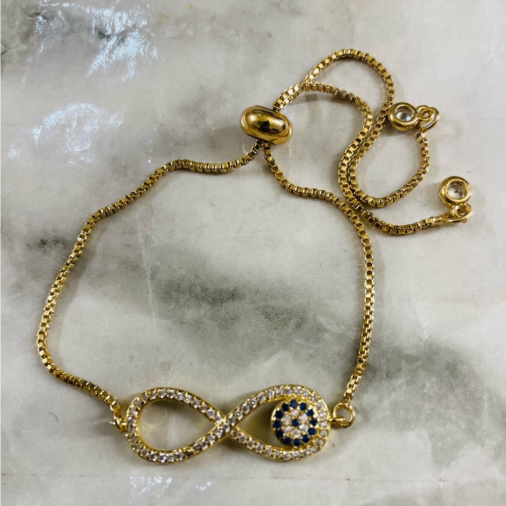 9.5in Oro laminado 18K Gold Infinity Evil Eye Bracelet w/ Clear and Black Stone - Picture 3 of 4